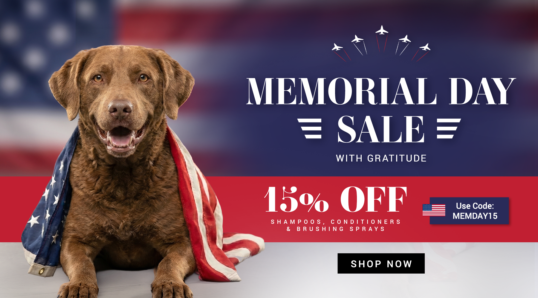 Dog wrapped in an American flag with Memorial Day sale text and promotional offer on a blurred flag background